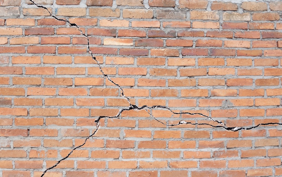 Brick building with cracked foundation