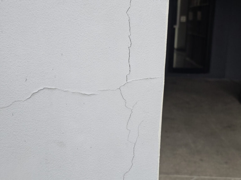 hairline cracks on outside wall building