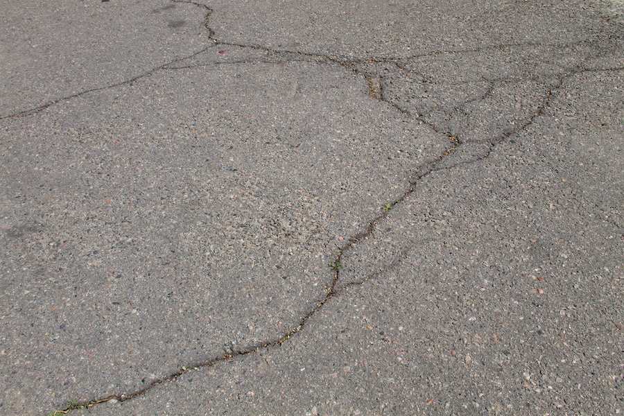 cracks on asphalt background
