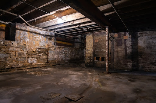 Interior of old grungy warehouse basement.